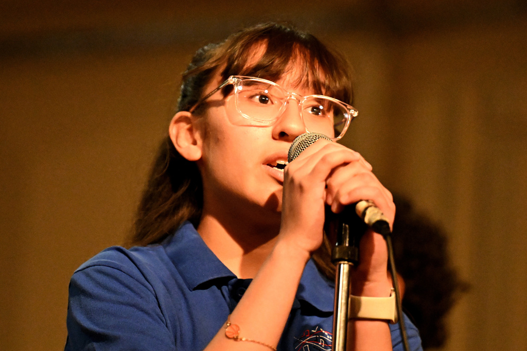  girls singing at a choir concert