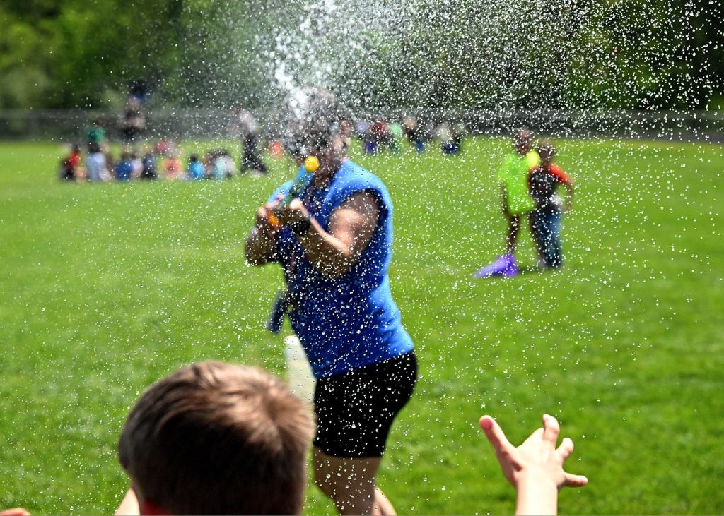 someone shooting a squirt gun at the camera