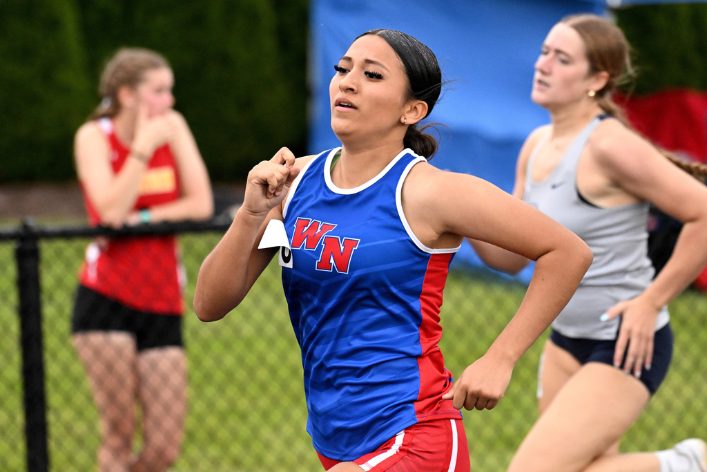 two girls running on the track