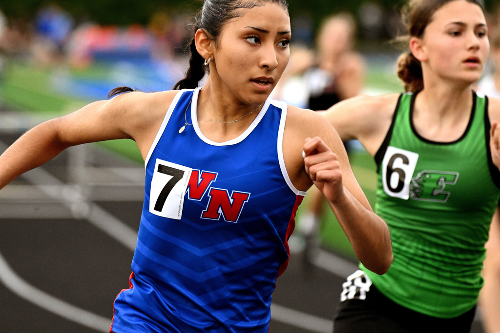 two girls running on the track