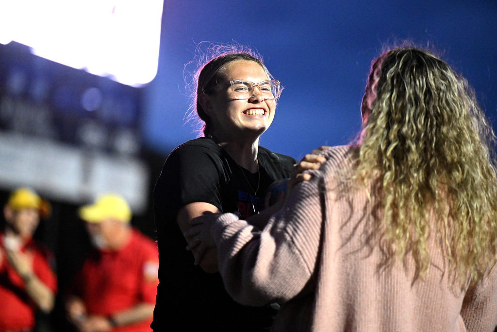 a girl hugging her mom