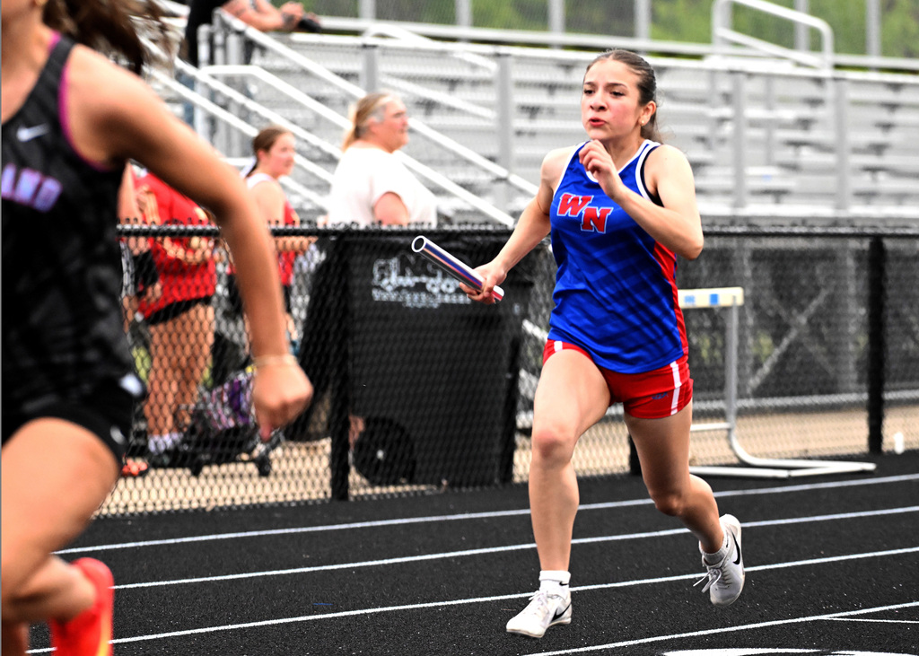 girl running with a baton
