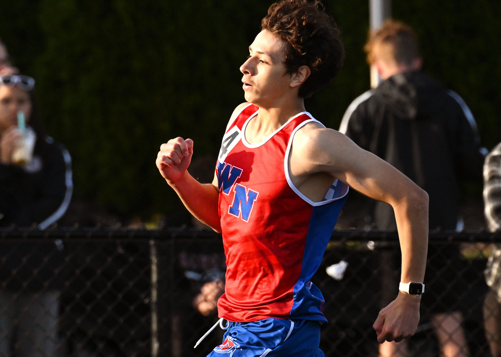 track athlete running around the track