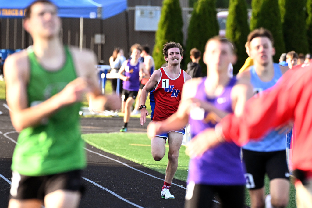 track athlete running around the track