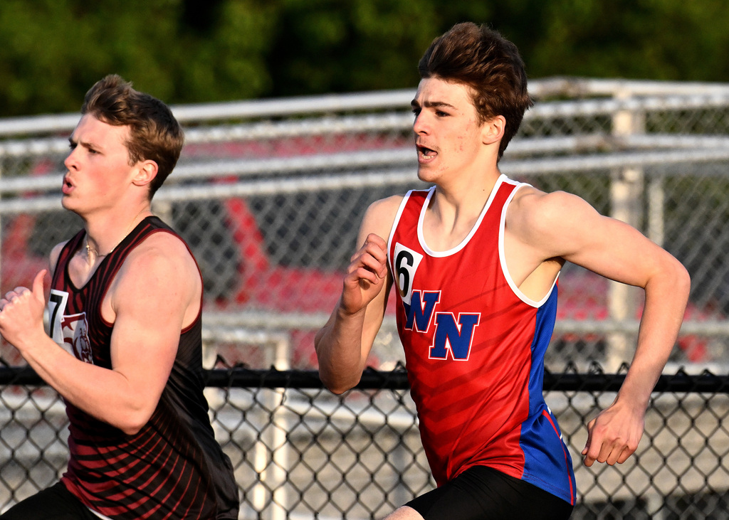 track athlete running around the track