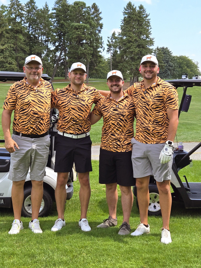 group of golfers wearing tiger stripes