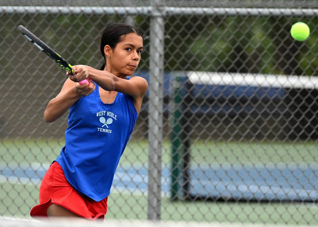 a girl playing tennis