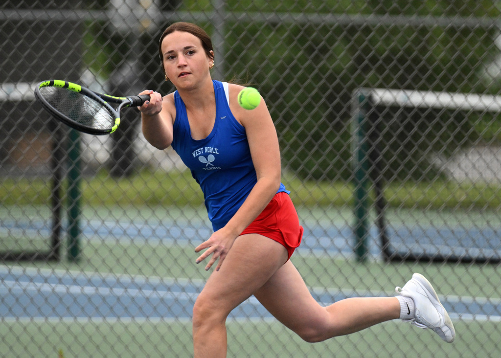 a girl playing tennis