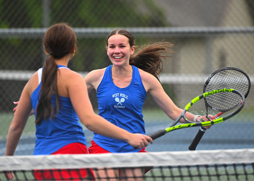 two girls celebrating at tennis