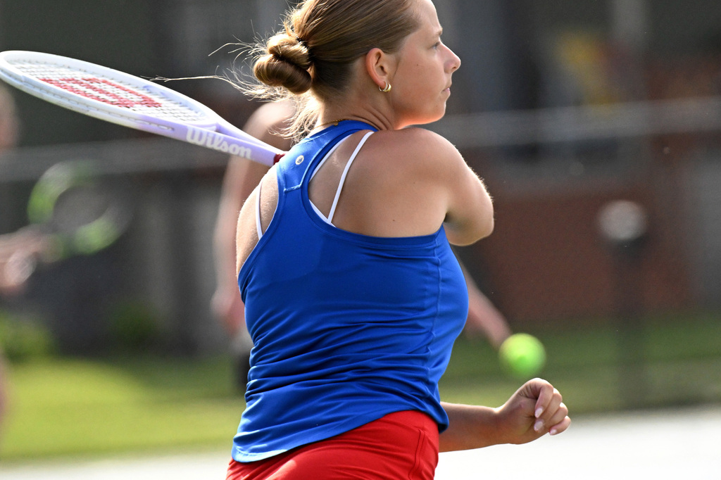a girl playing tennis