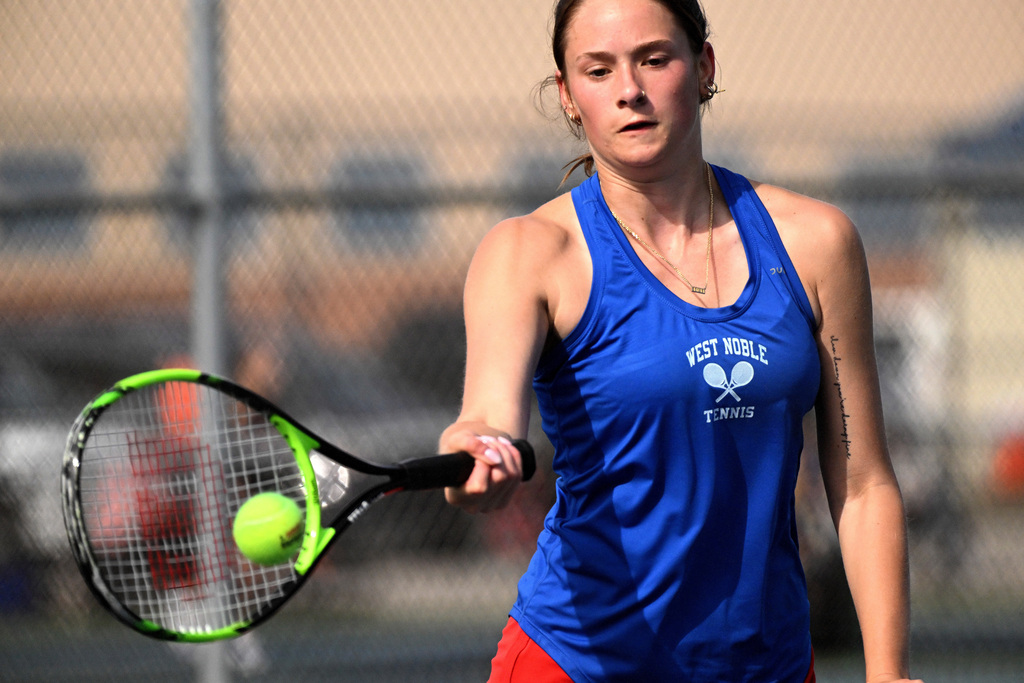 a girl playing tennis