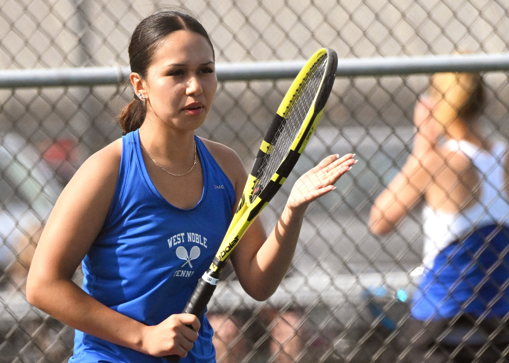 a girl playing tennis