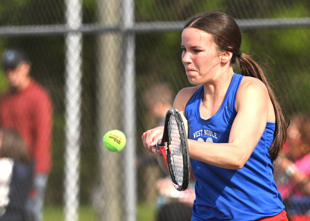 a girl playing tennis