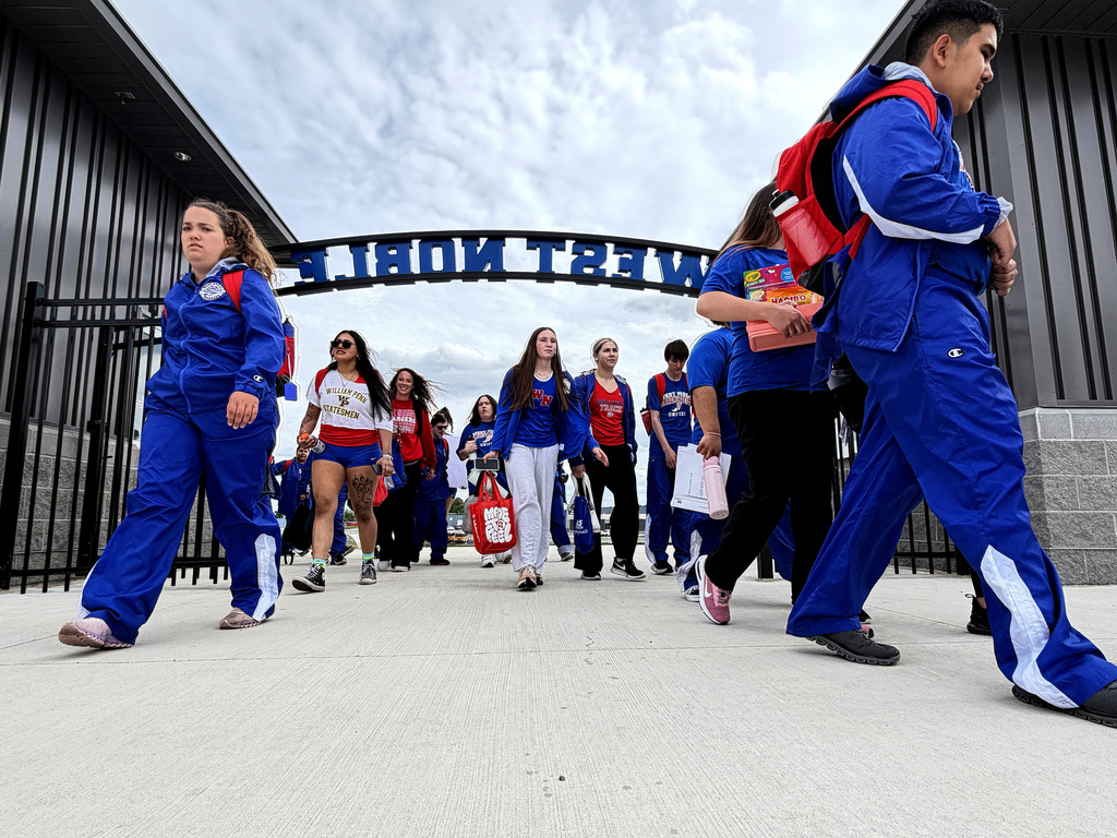 track athletes walking into the stadium