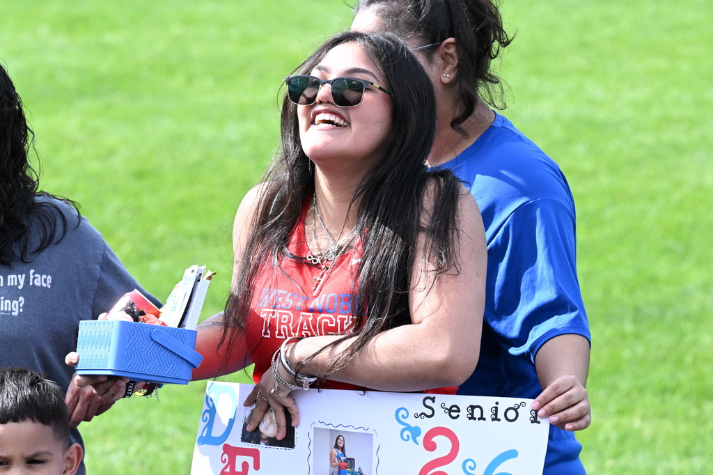 a senior laughing at her senior day at track