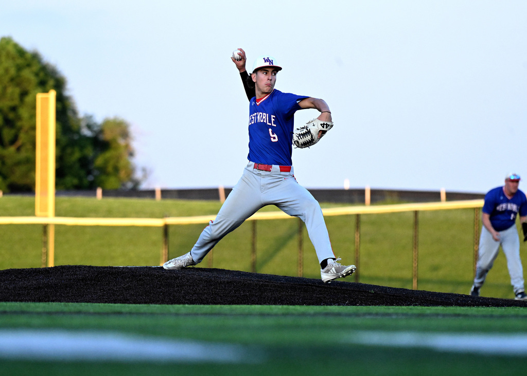 a baseball player pitching the ball