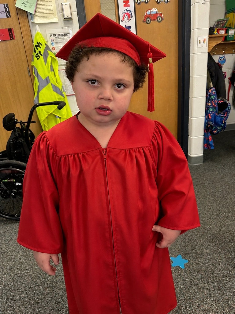 a little kid at a graduation ceremony