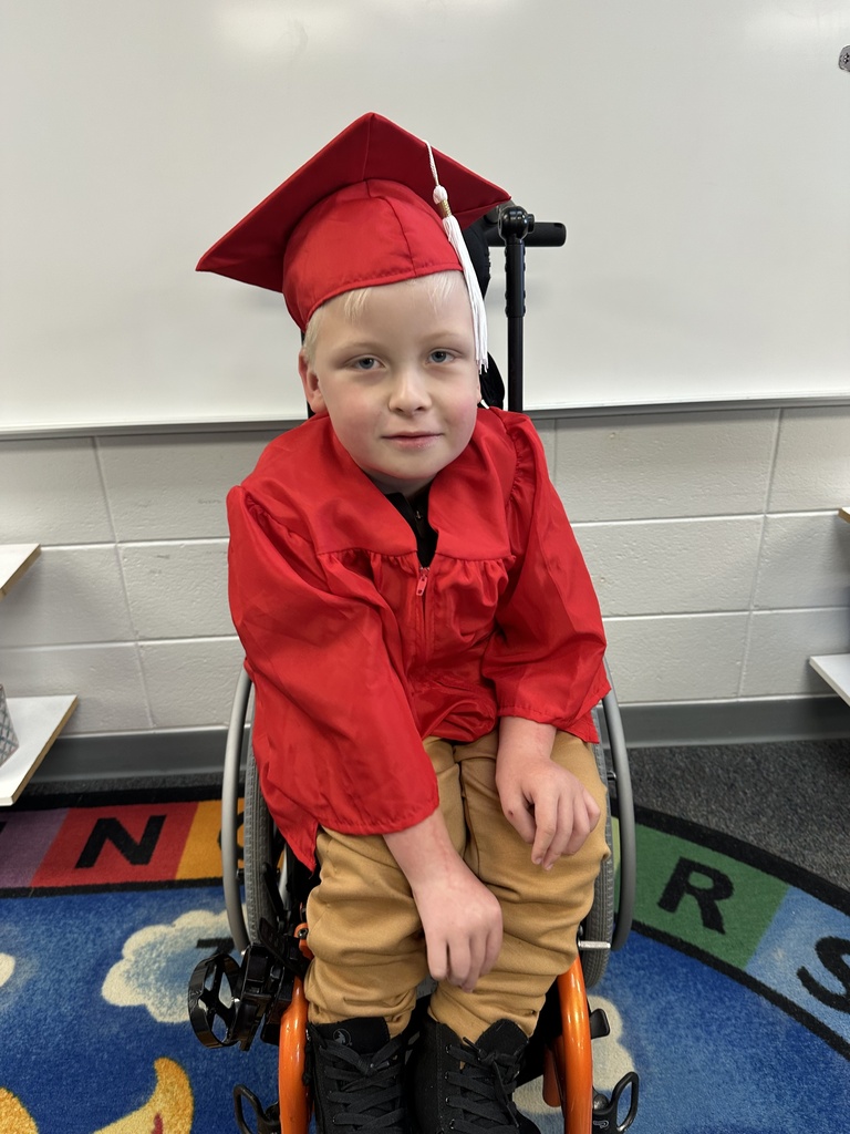 a little kid at a graduation ceremony
