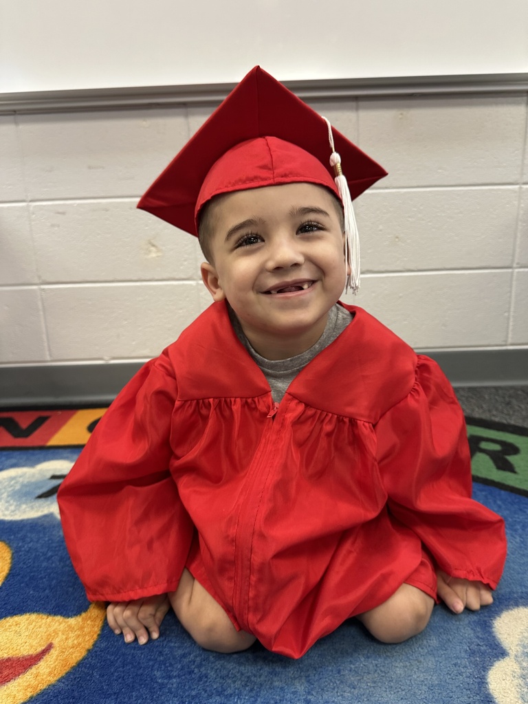 a little kid at a graduation ceremony