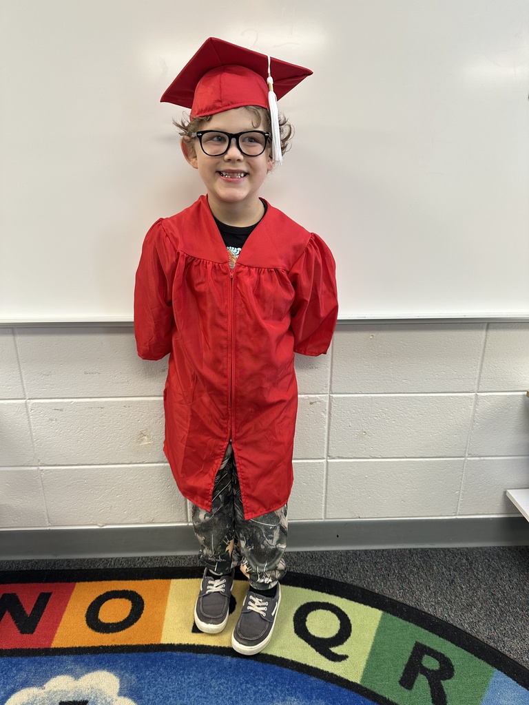 a little kid at a graduation ceremony