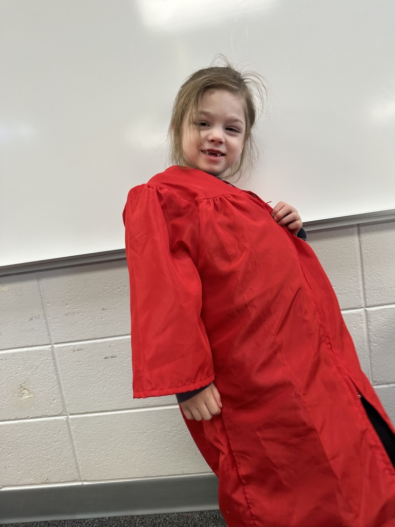 a little kid at a graduation ceremony