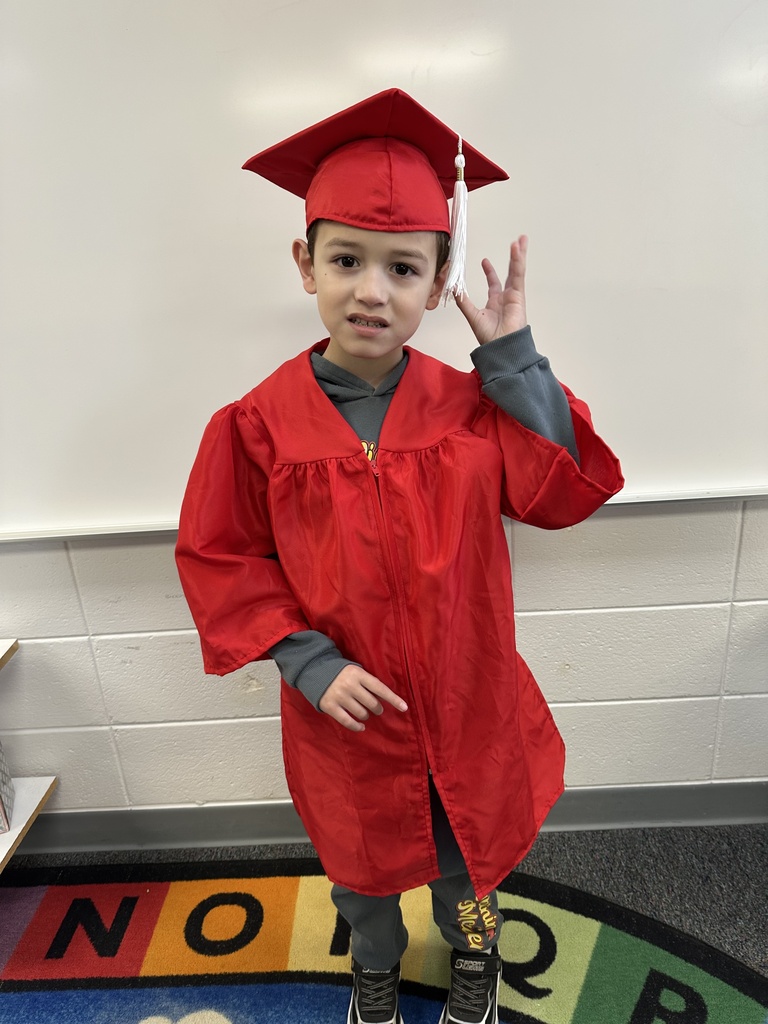 a little kid at a graduation ceremony