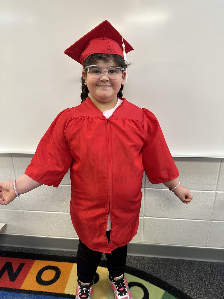 a little kid at a graduation ceremony