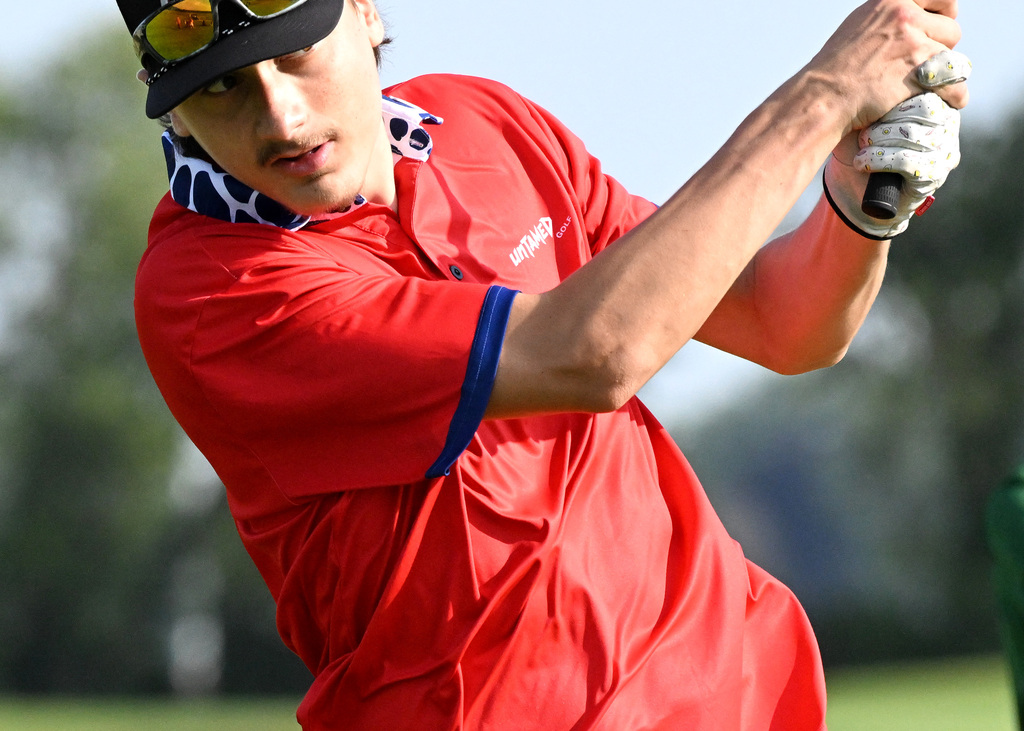 golfer hitting in the fairway