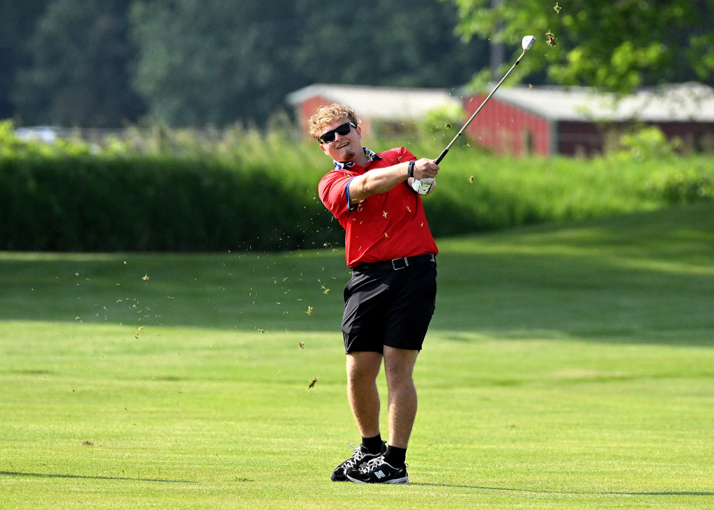 golfer hitting in the fairway