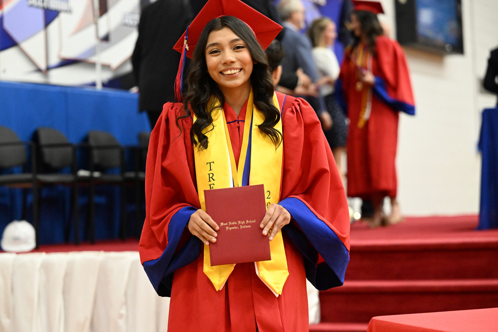 a high school graduate with her diploma