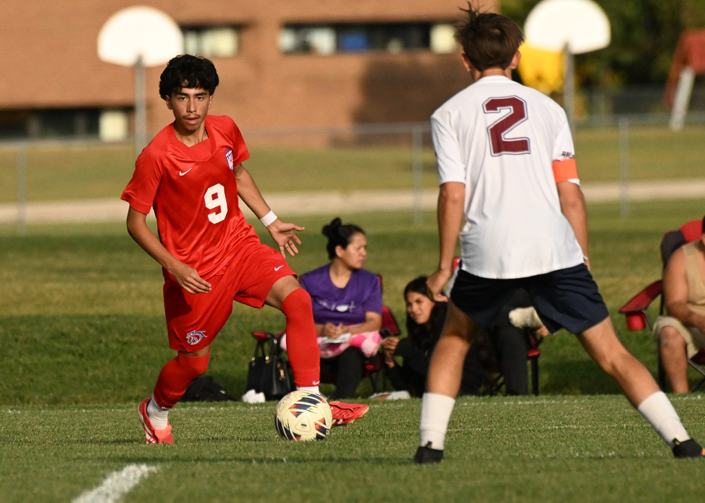 boy playing soccer