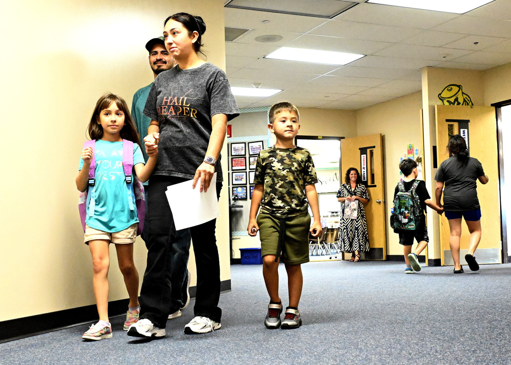 people walking in a hallway