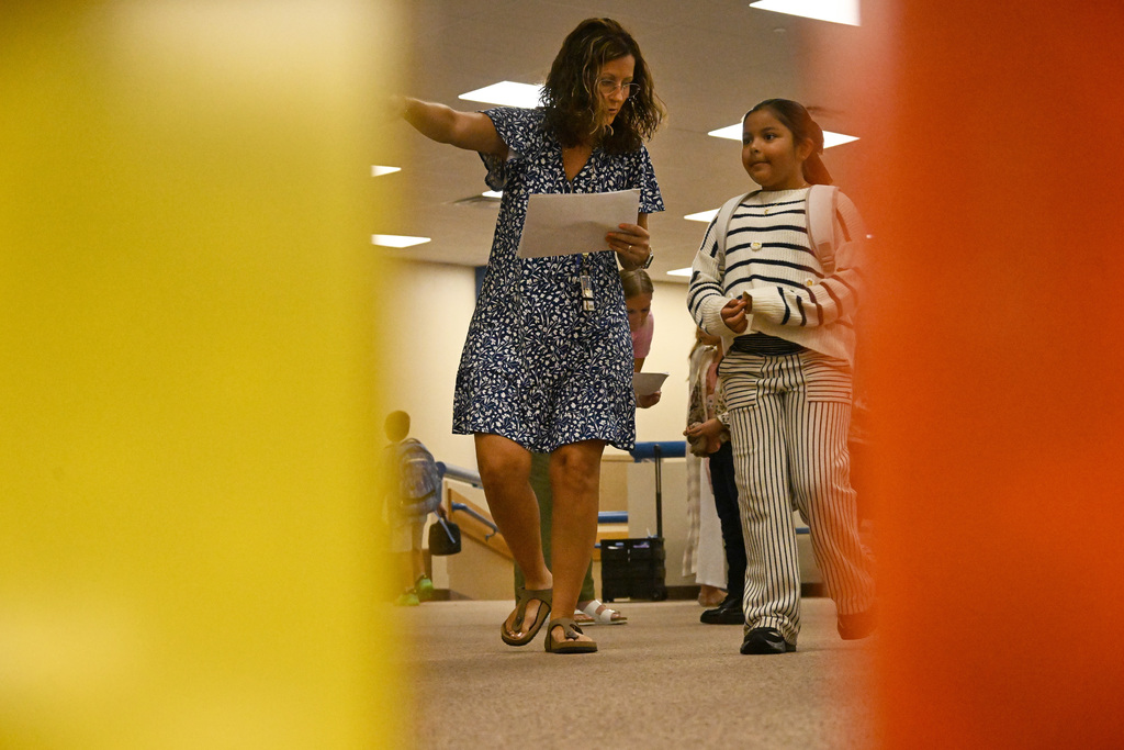 a teacher and a student walking and talking