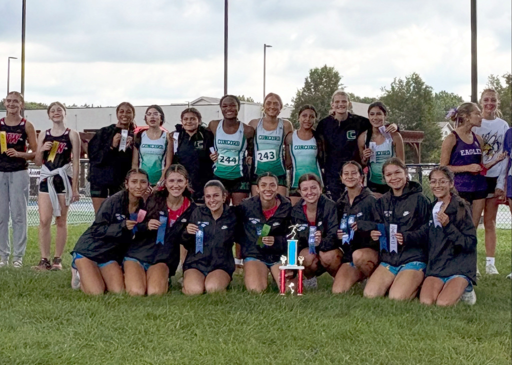 several girls posing with ribbons