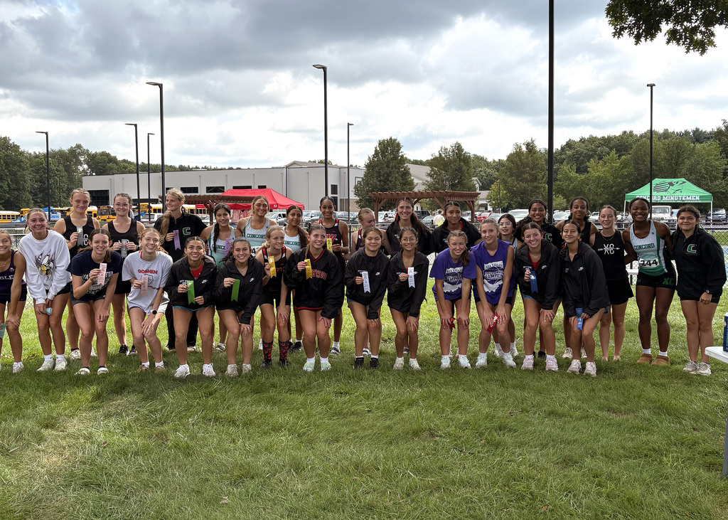 several girls posing with ribbons