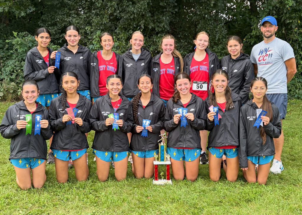 several girls posing with ribbons