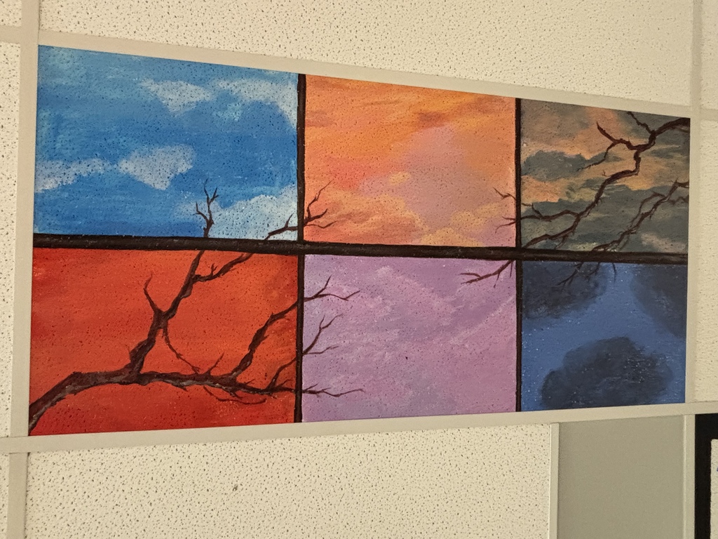 a painting with multiple colors with a dead tree limb