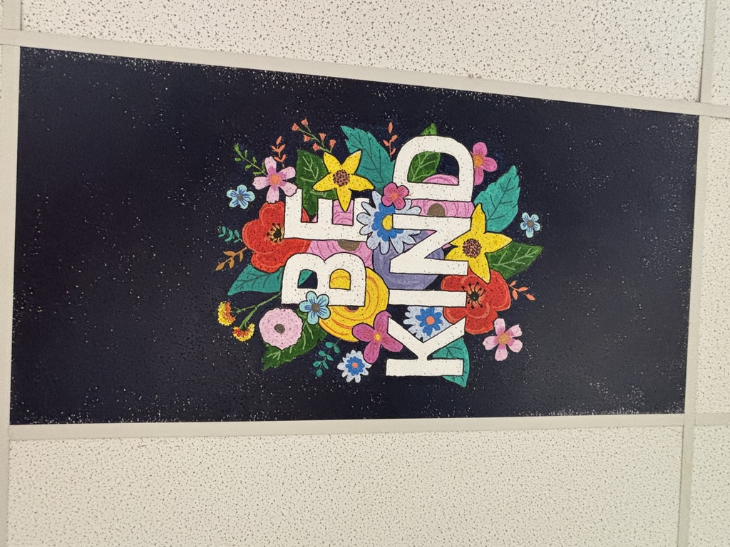 the words be kind and flowers painted on a ceiling tile