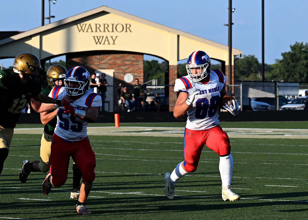 a football player running with the ball