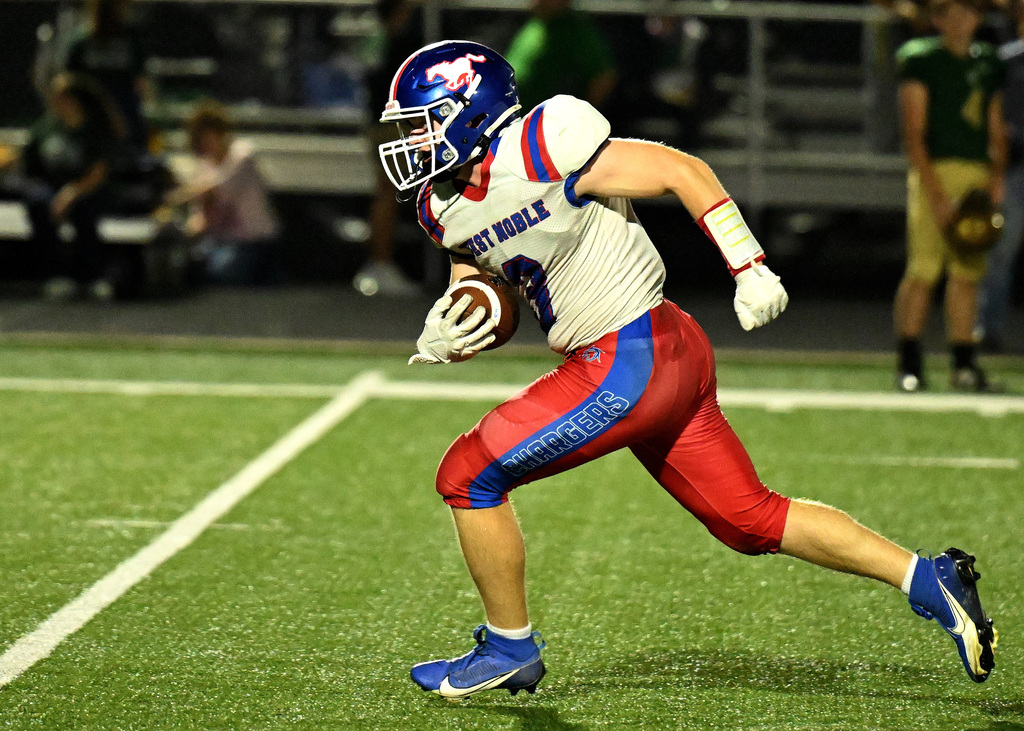 a football player running with the ball
