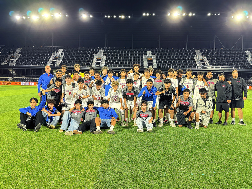 boys soccer team posing for a picture