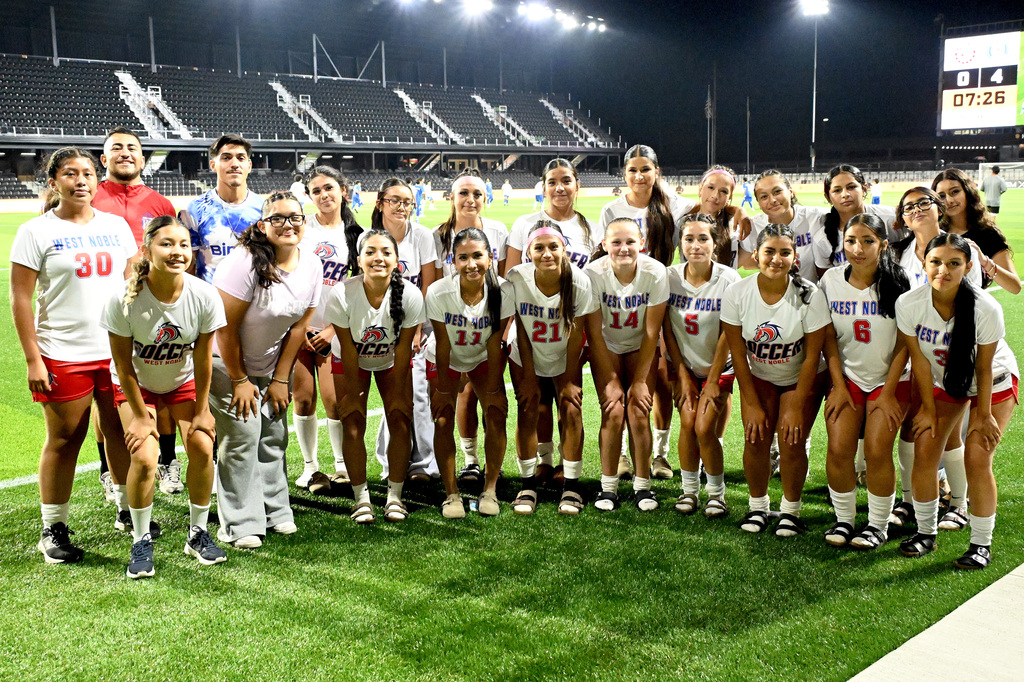 girls soccer team posing for a picture