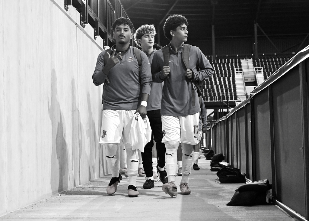 soccer players walking