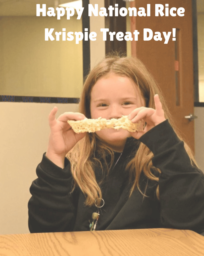 a girl eating a rice krispie treat