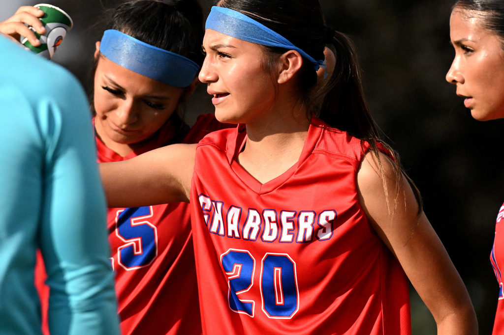 a girl smiling at soccer