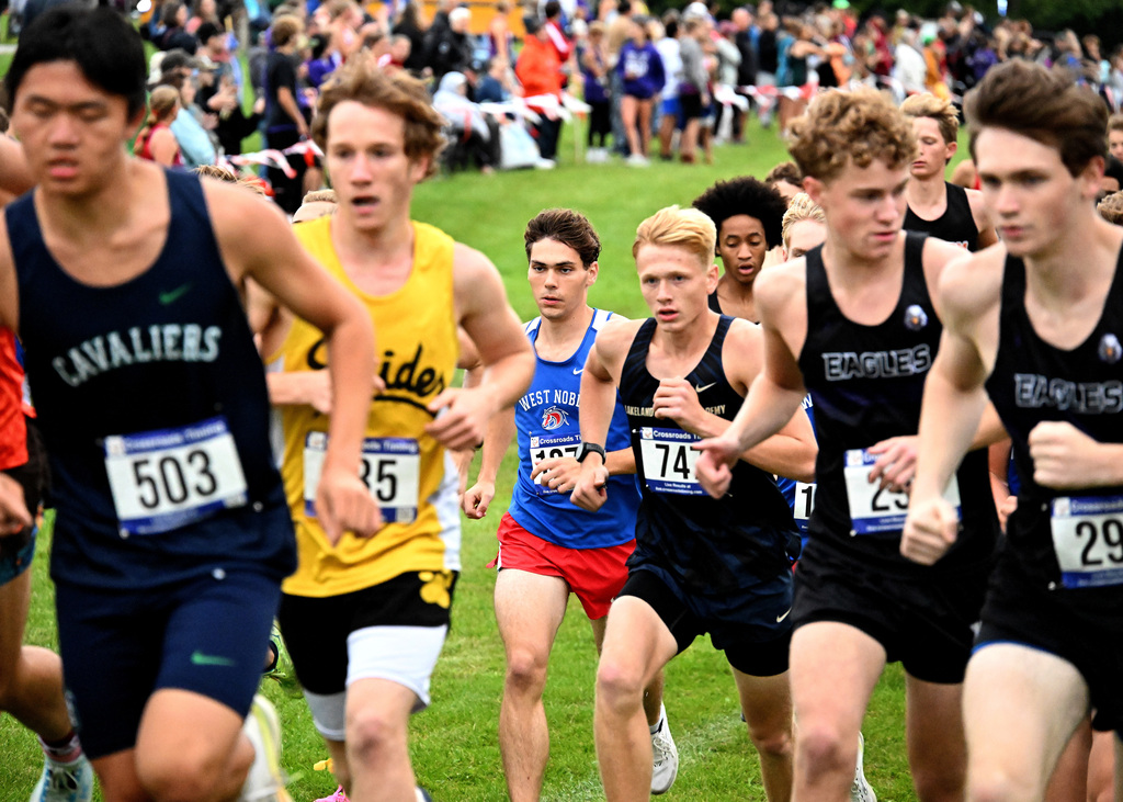 boy in blue and red running a race