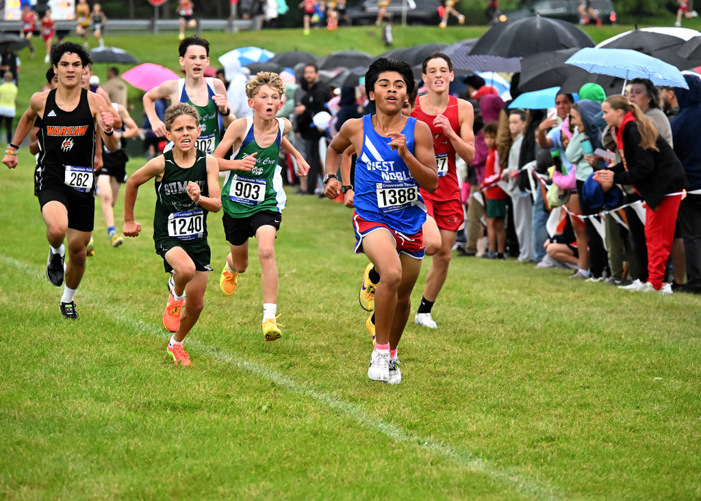 boy in blue and red running a race
