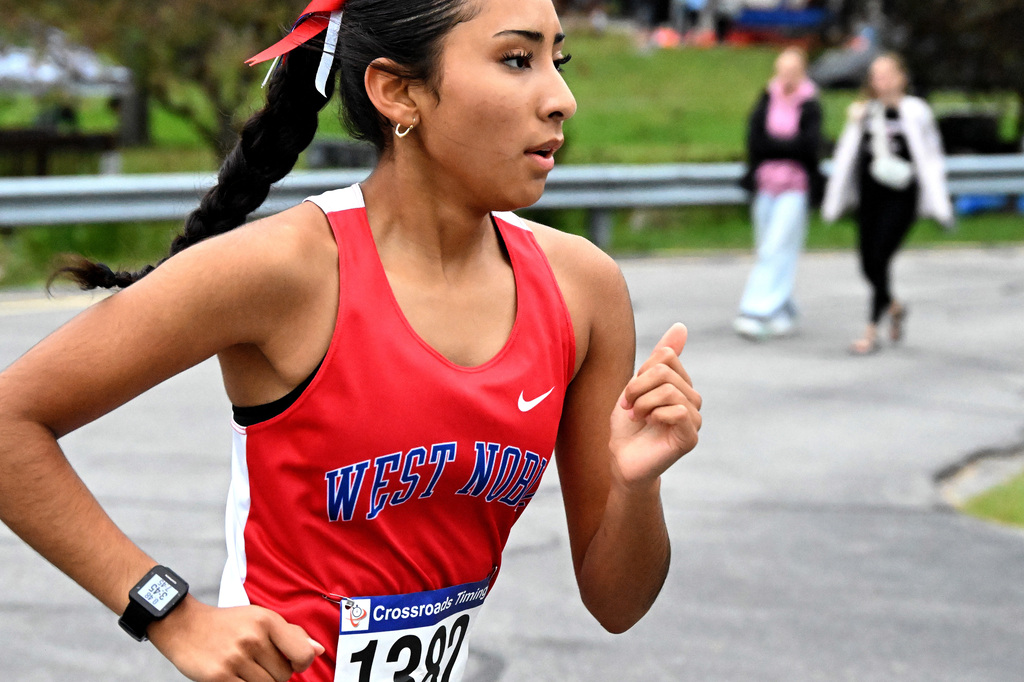 girl in blue and red running a race