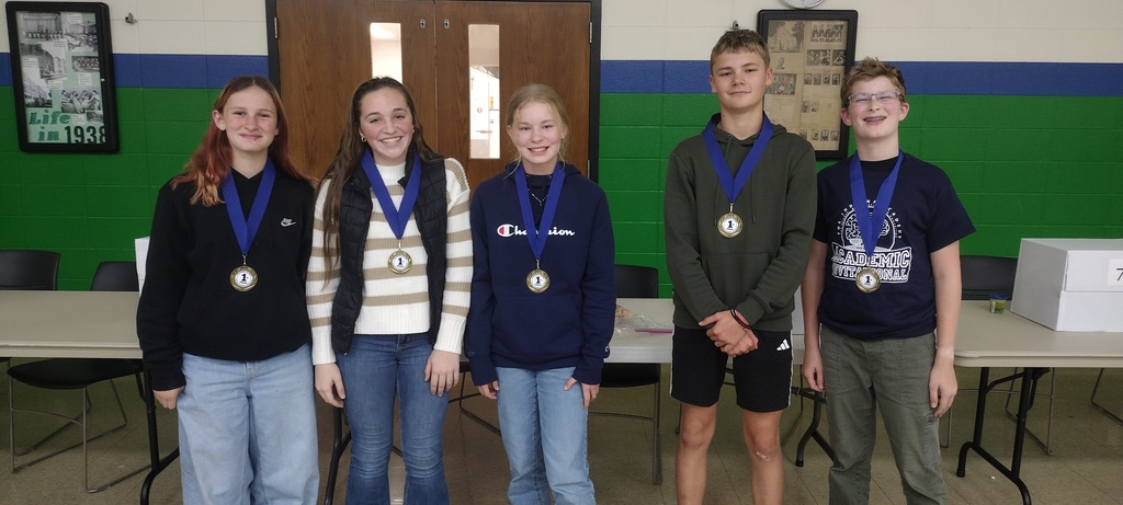 five students with medals