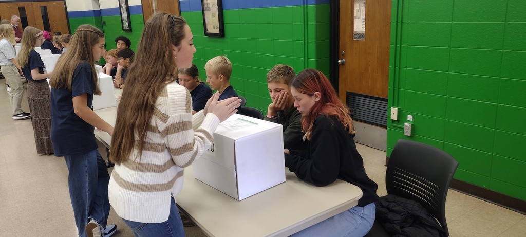three students talking